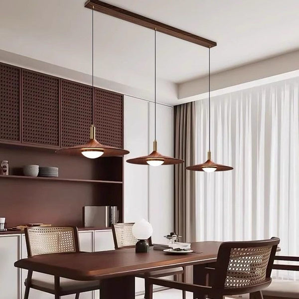 3-in-1 Scandinavian Chandelier in wood finish hanging in a Nigerian living room