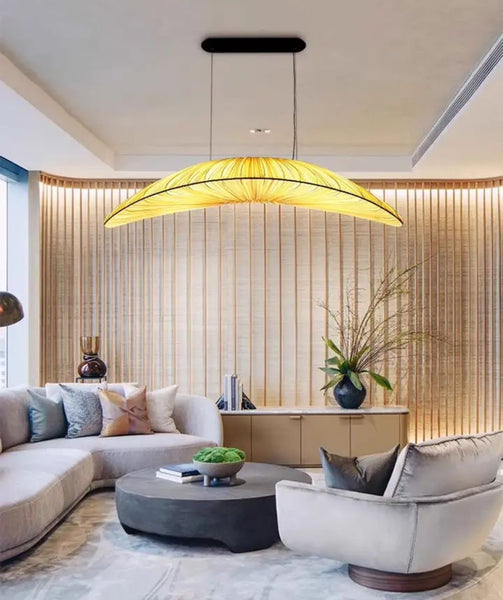 Wabi-Sabi fabric chandelier with woven fabric shades hanging in a Nigerian living room