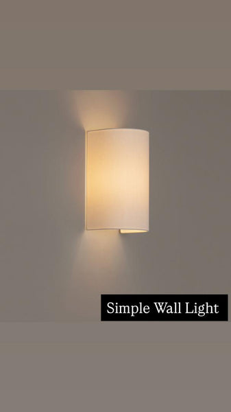Gill white linen wall light mounted on a wall