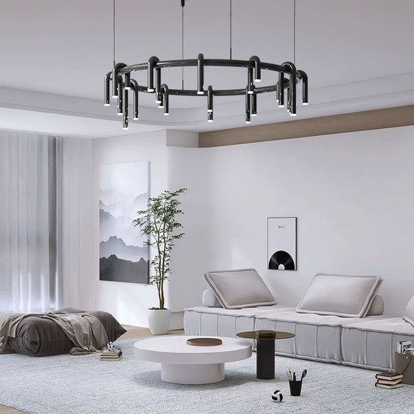 Lustre black tube chandelier illuminated in a living room
