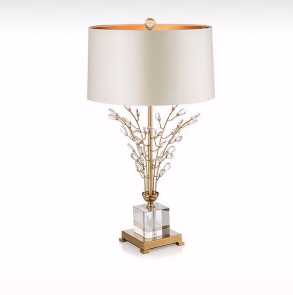 Clara Crystal Table Lamp with cloth shade on a Nigerian side table