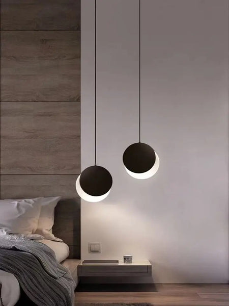 Lunar Eclipse Pendant Light styled above a dining table in Nigeria