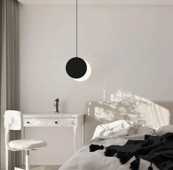 Lunar Eclipse Pendant Light hanging in a Nigerian bedroom