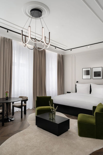 U-shaped chandelier hanging in a bedroom