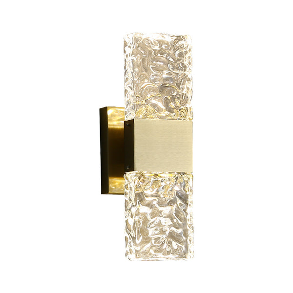 Frosted crystal wall sconce illuminated, showing warm ambient glow