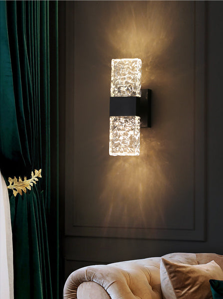 Frosted crystal wall sconce in a dining room setting
