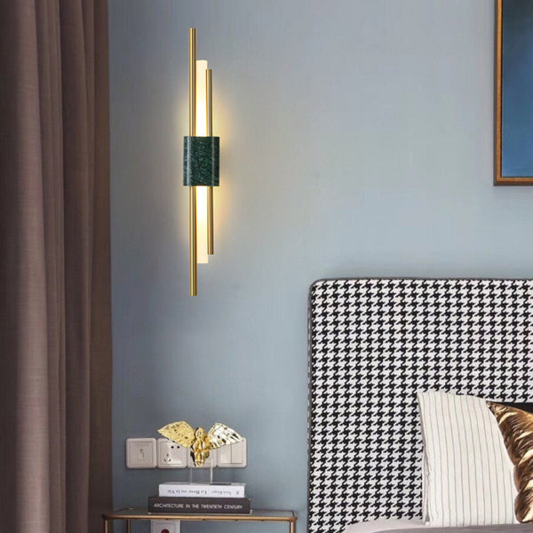 Close-up of Monet wall light's deep green marble and brass design