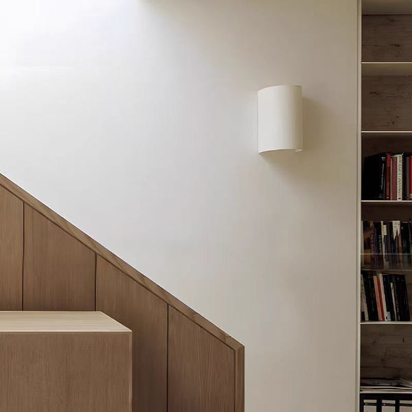 Gill fabric wall light illuminated with warm glow
