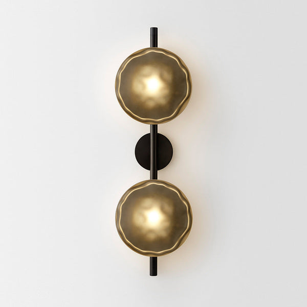 Ceto wall light illuminated, showing water-like shadow reflections