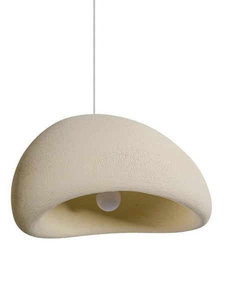 Wabi-Sabi white resin light hanging in a dining area