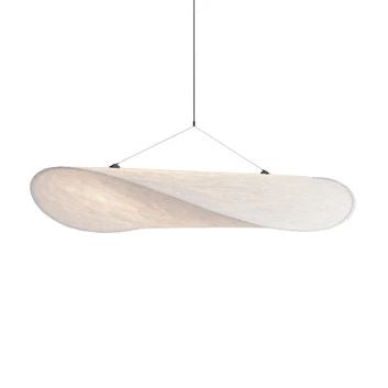 Tense chandelier illuminated with warm light