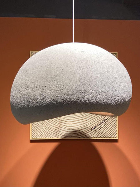 Wabi-Sabi grey resin light hanging in a dining area