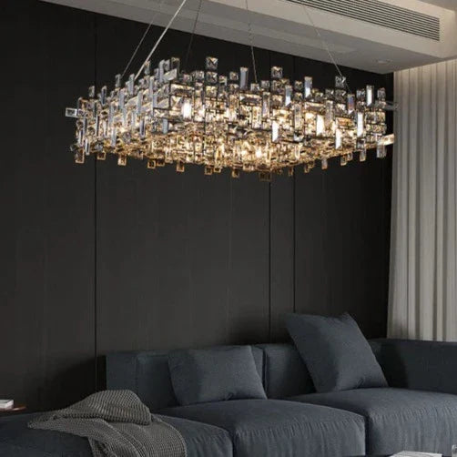 Lynn square crystal chandelier illuminated in a living room