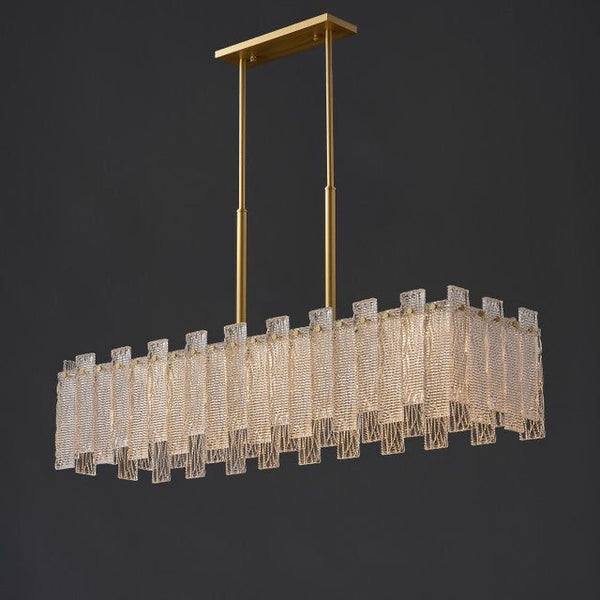 Synfonia rectangle chandelier illuminated in a dining room