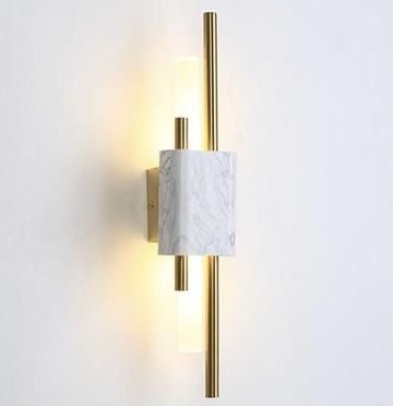 Monet wall light illuminated with warm glow