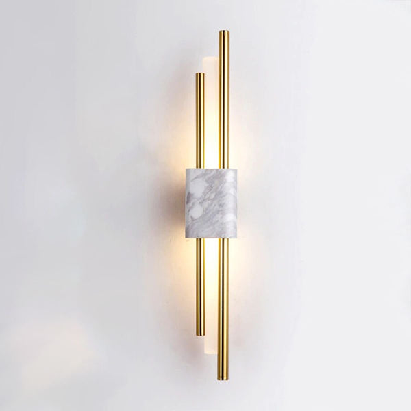 Close-up of Monet wall light's white marble and brass design