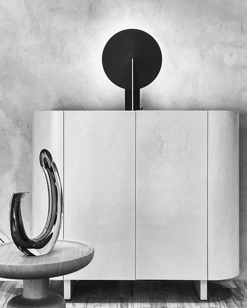 Orbe black table lamp on a side table