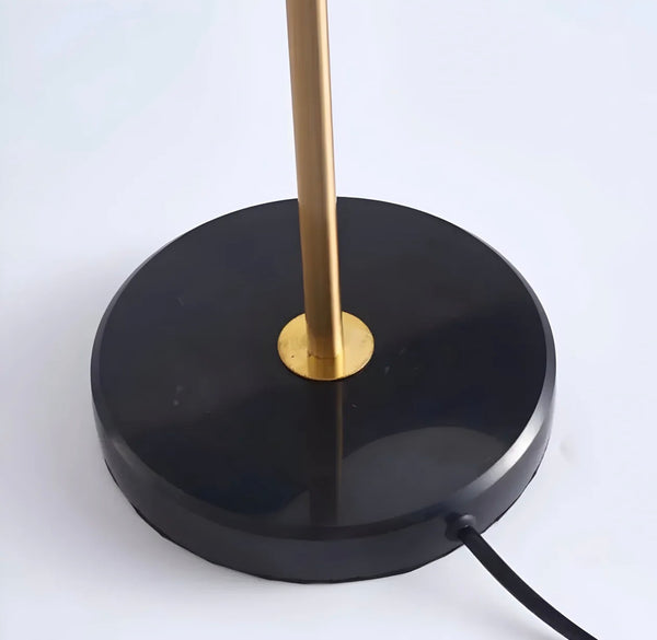 Lume Noir lamp on a side table