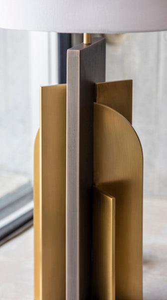 Icon table lamp illuminated in a living room setting