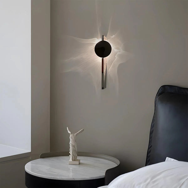 Water Wave wall light illuminated with warm glow