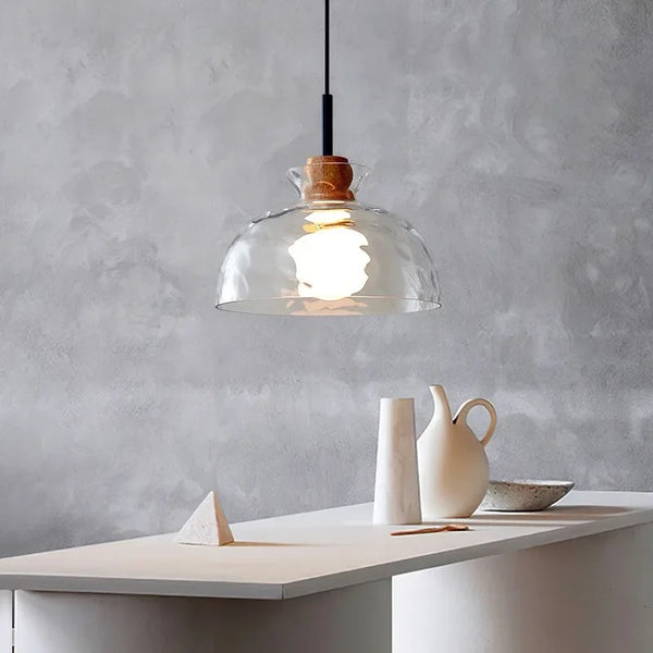 Nina frosted droplight hanging in a dining area