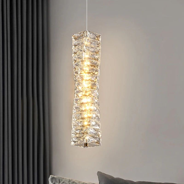 Spiral crystal droplight in gold finish above a kitchen island