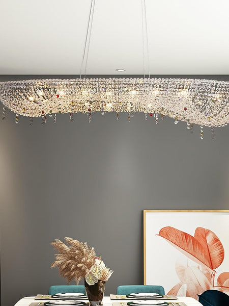 Oval crystal chandelier illuminated, showing crystal detailing