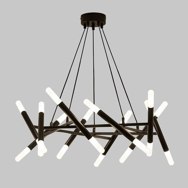 Belmont chandelier illuminated in warm light in a living room