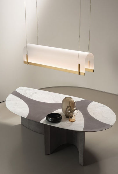 Baxter Chandelier illuminated above a dining table in Nigeria