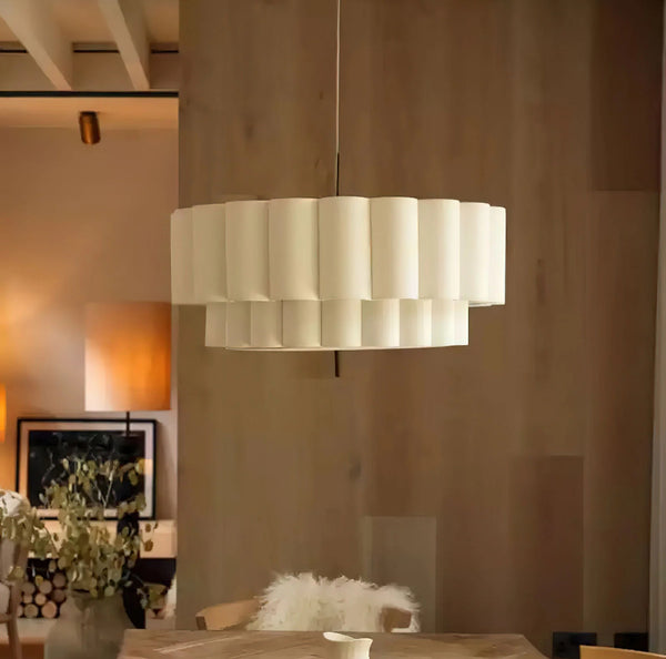 Folia Ripple Chandelier illuminated above a dining table in Nigeria