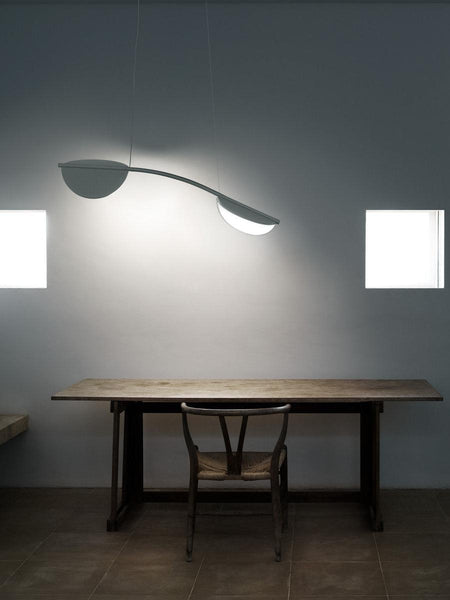 Almendra Arc Suspension Light styled in a Nigerian hotel lobby