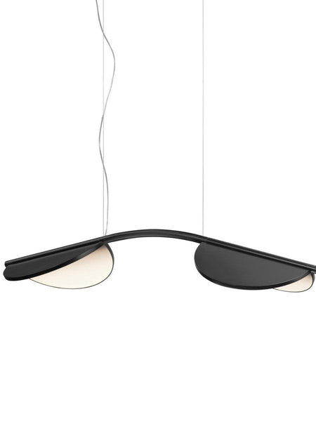 Almendra Arc Suspension Light hanging in a Nigerian living room