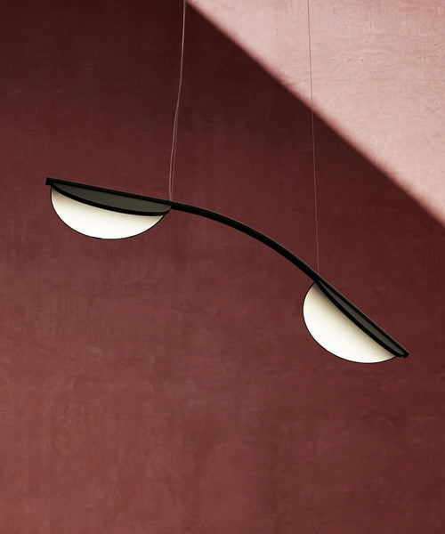 Close-up of Almendra Arc Suspension Light showing rotating leaf detail