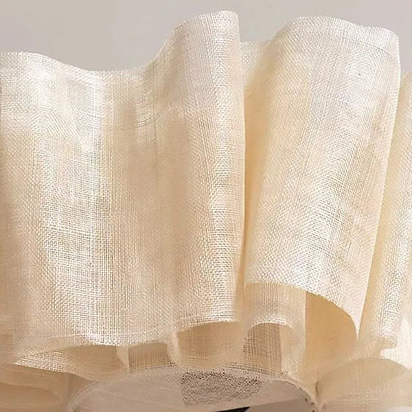 Wabi Sabi fabric chandelier illuminated with warm light