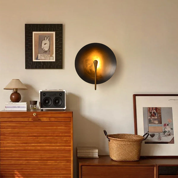 Alena bronze wall light illuminated with warm LED glow