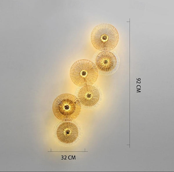 Lotus Leaf wall sconce installed beside a bed in a Nigerian bedroom
