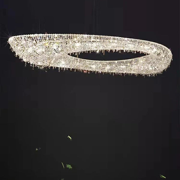 Atoll crystal chandelier illuminated in warm white light