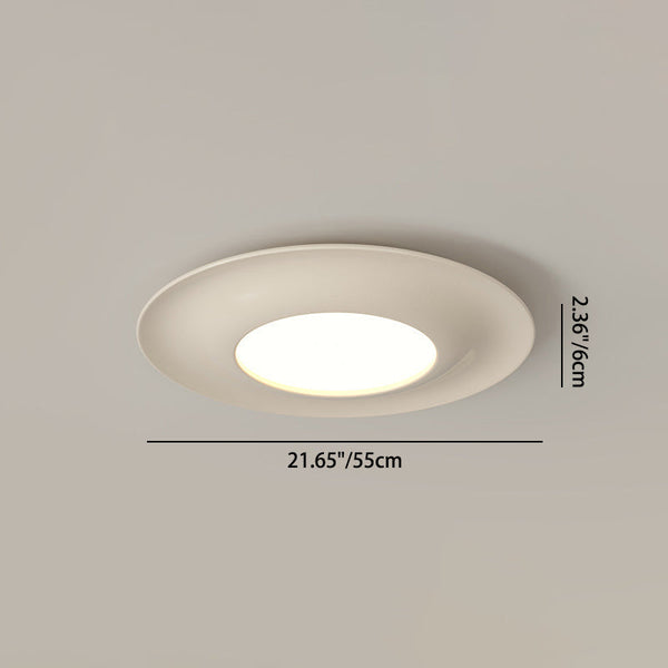 Macaron cream ceiling light illuminated, bright warm glow