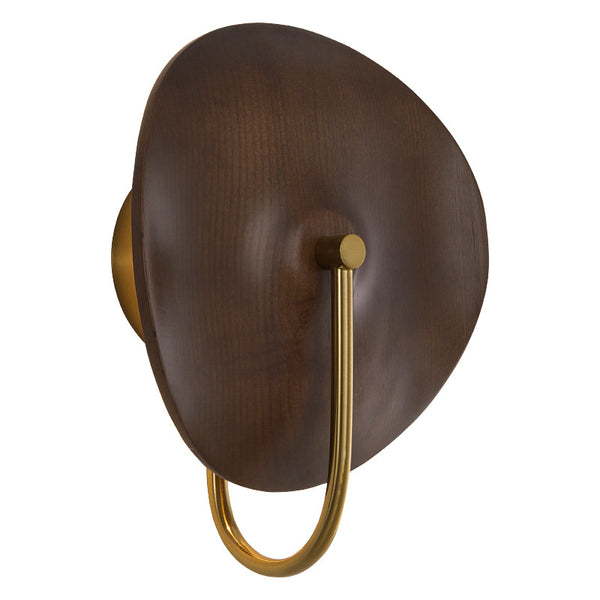 Solid wood wall light mounted on a Nigerian bedroom wall