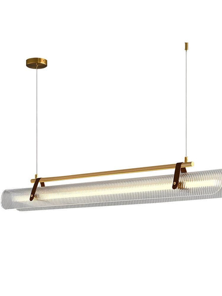 Niani gold linear pendant light above a dining table