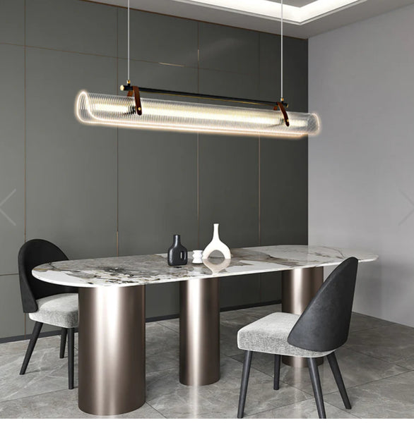 Niani black pendant light illuminated in a modern interior