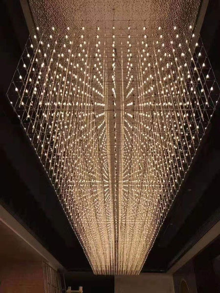 Silver Universe chandelier illuminated in a large space