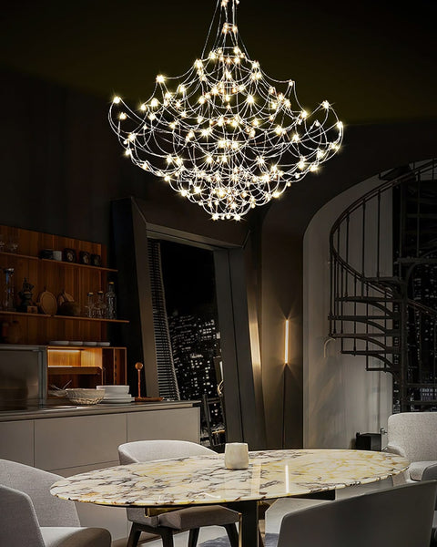 Silver Constellation chandelier illuminated in a luxury living room