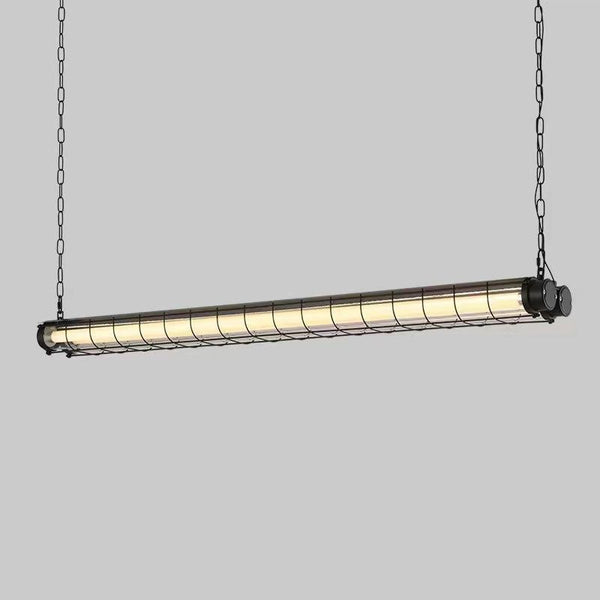 Black industrial suspension light hanging in a room
