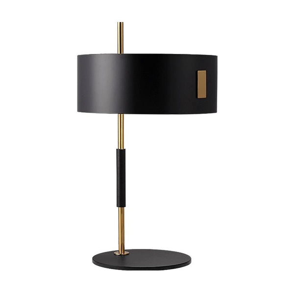 Oluce table lamp illuminated on a bedside table