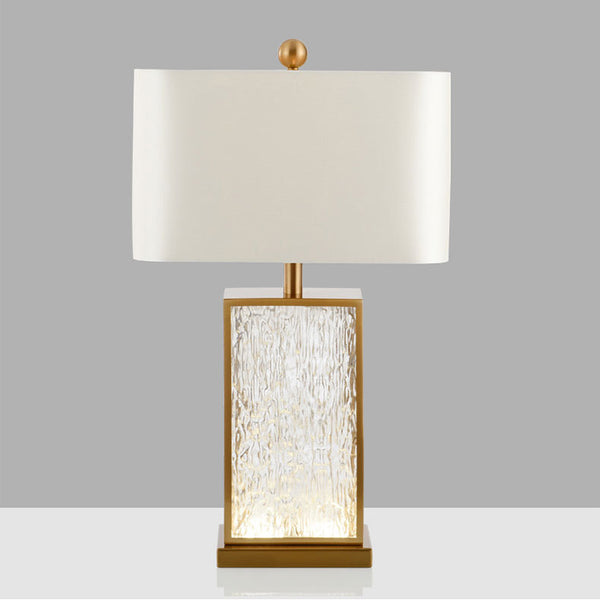 Frosted Pattern Table Lamp with brass base on a Nigerian side table