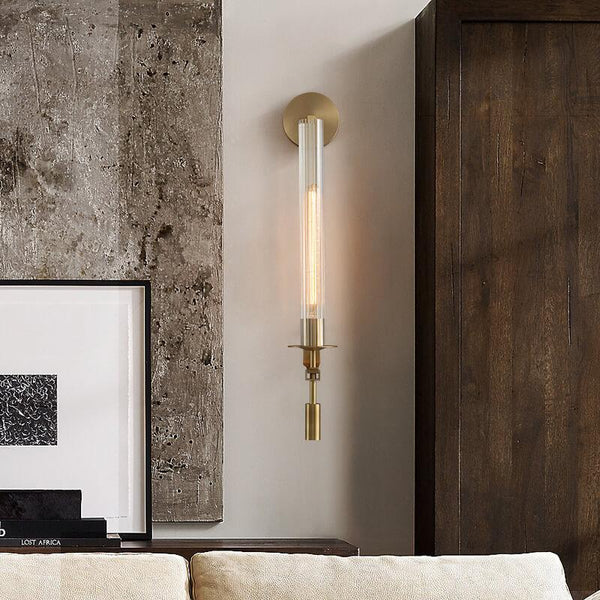 Brass vintage wall light in a bedroom setting