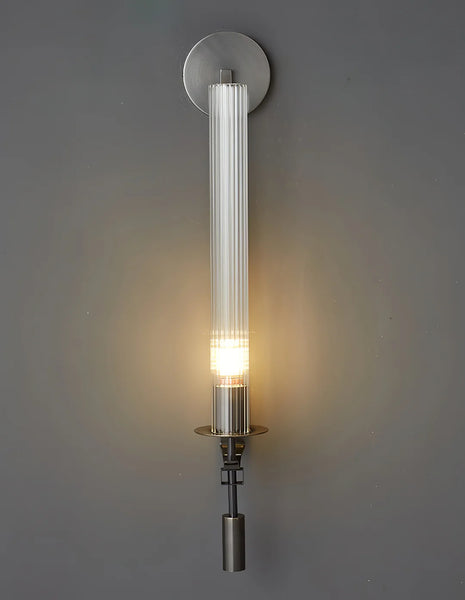 Black vintage wall light illuminated with warm glow