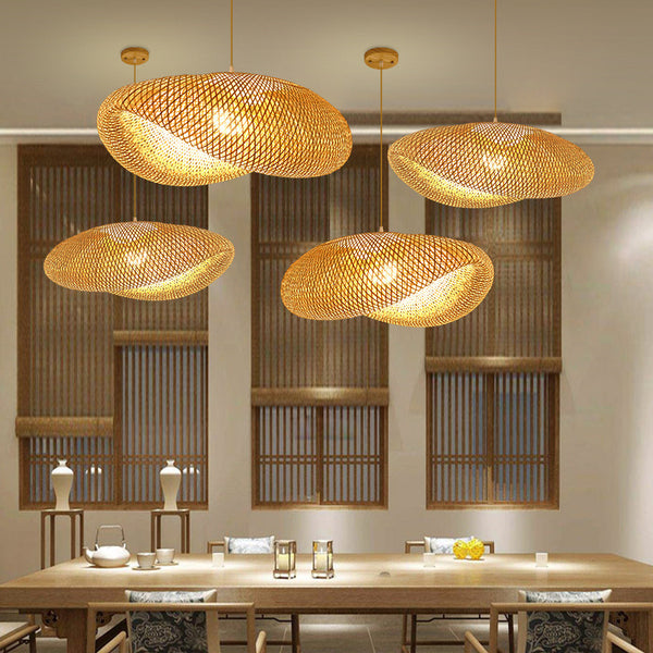 Rattan doughnut pendant light hanging above a dining table