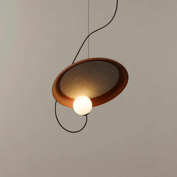 Flos Droplight in red hanging in a Nigerian living room